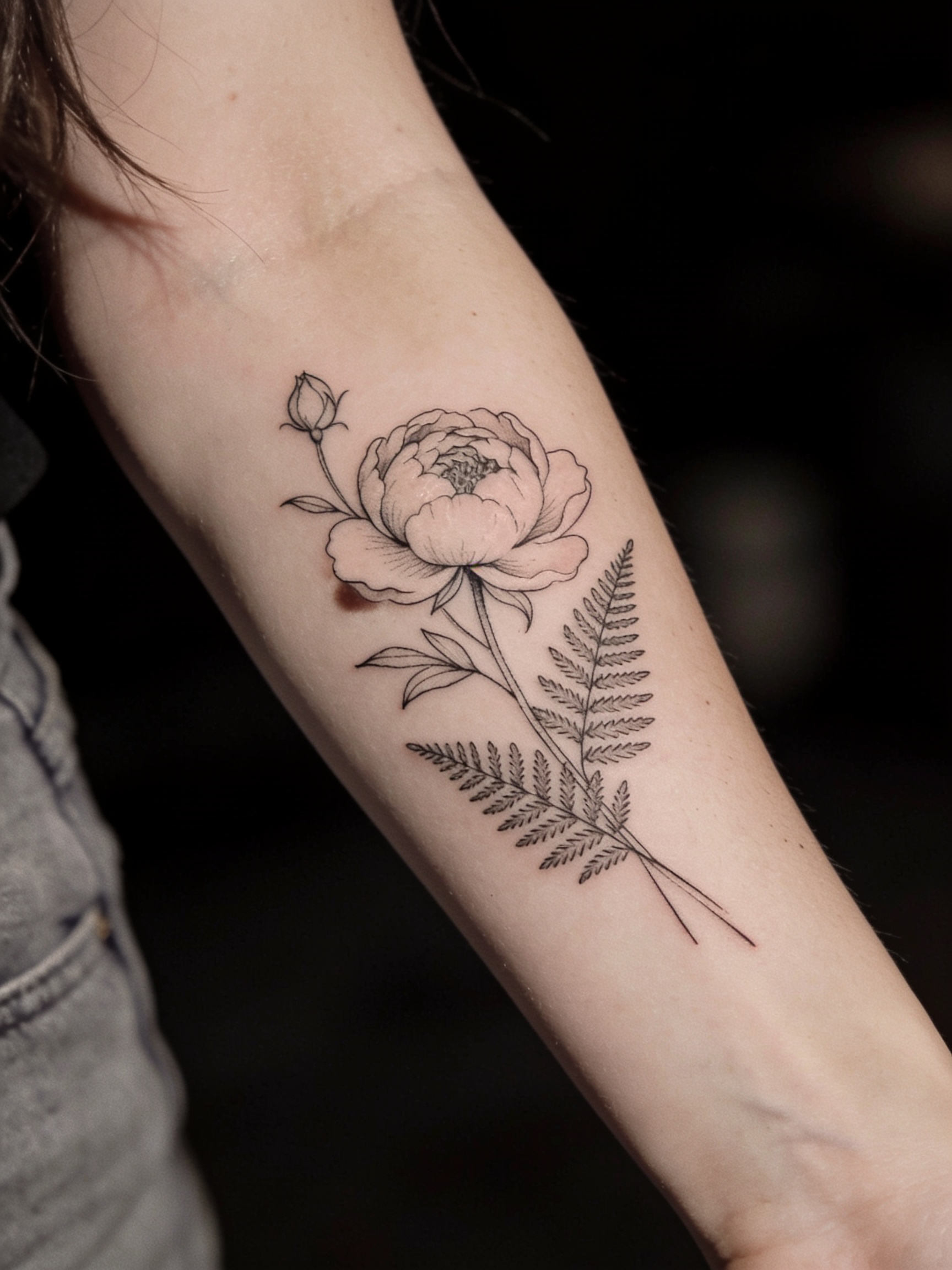 Fine line botanical tattoo